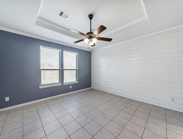20015 Flax Flower Dr, Richmond, TX 77407 - empty room featuring a raised ceiling, ceiling fan, ornamental molding, and light tile patterned floors