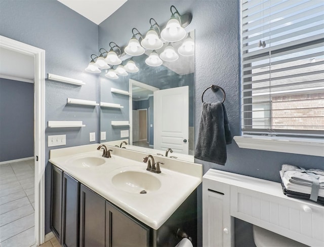 20015 Flax Flower Dr, Richmond, TX 77407 - bathroom with tile patterned floors, double vanity, and a textured wall