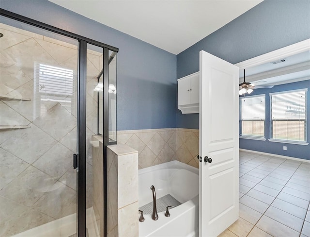 20015 Flax Flower Dr, Richmond, TX 77407 - bathroom featuring a bath, a shower stall, a ceiling fan, and tile patterned flooring