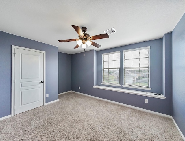 20015 Flax Flower Dr, Richmond, TX 77407 - carpeted empty room with ceiling fan and baseboards