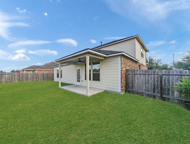 20015 Flax Flower Dr, Richmond, TX 77407 - back of house featuring brick siding, a ceiling fan, a patio area, and a fenced backyard