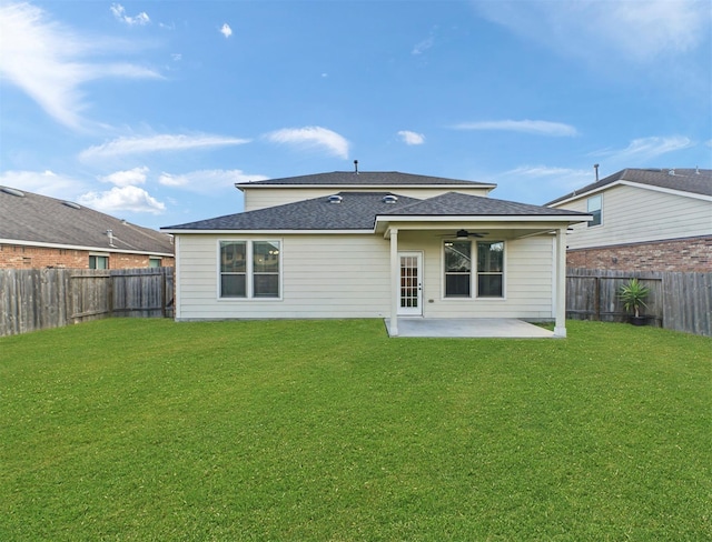 20015 Flax Flower Dr, Richmond, TX 77407 - back of house featuring ceiling fan, a patio area, a fenced backyard, and a shingled roof