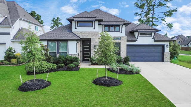 14807 Providence Manor Way, Cypress, TX 77429 - view of front of home with a shingled roof, brick siding, concrete driveway, and a front yard