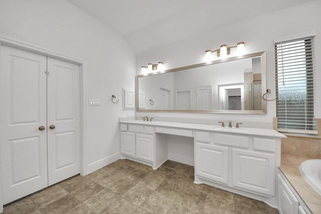 14807 Providence Manor Way, Cypress, TX 77429 - bathroom featuring double vanity, vaulted ceiling, and a garden tub