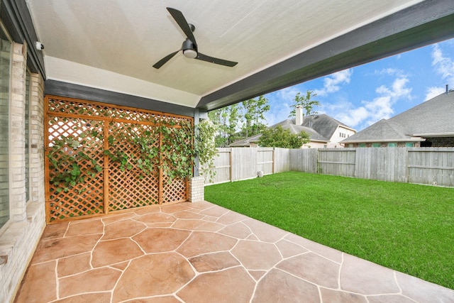 14807 Providence Manor Way, Cypress, TX 77429 - fenced backyard featuring a patio and ceiling fan