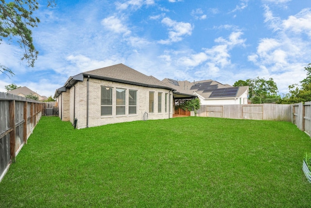 14807 Providence Manor Way, Cypress, TX 77429 - rear view of property with a fenced backyard, brick siding, and a shingled roof