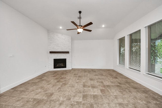 14807 Providence Manor Way, Cypress, TX 77429 - unfurnished living room featuring ceiling fan, vaulted ceiling, a stone fireplace, and recessed lighting