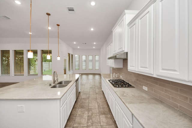 14807 Providence Manor Way, Cypress, TX 77429 - kitchen with under cabinet range hood, stainless steel appliances, decorative backsplash, white cabinetry, and recessed lighting