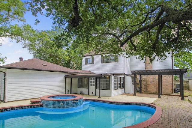 15102 Torry Pines Rd, Houston, TX 77062 - view of pool with a pergola, a sunroom, a pool with connected hot tub, and a patio