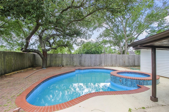 15102 Torry Pines Rd, Houston, TX 77062 - view of swimming pool featuring a fenced backyard, a pool with connected hot tub, and a patio
