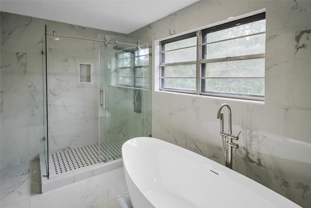 15102 Torry Pines Rd, Houston, TX 77062 - bathroom featuring a marble finish shower, a freestanding tub, and marble finish floors