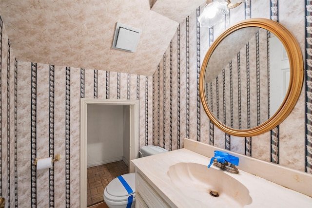 12223 Gladewick Dr, Houston, TX 77077 - half bath with brick patterned floors, wallpapered walls, and vanity