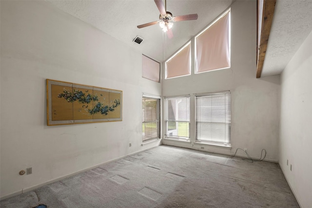 12223 Gladewick Dr, Houston, TX 77077 - carpeted spare room with ceiling fan, high vaulted ceiling, and a textured ceiling