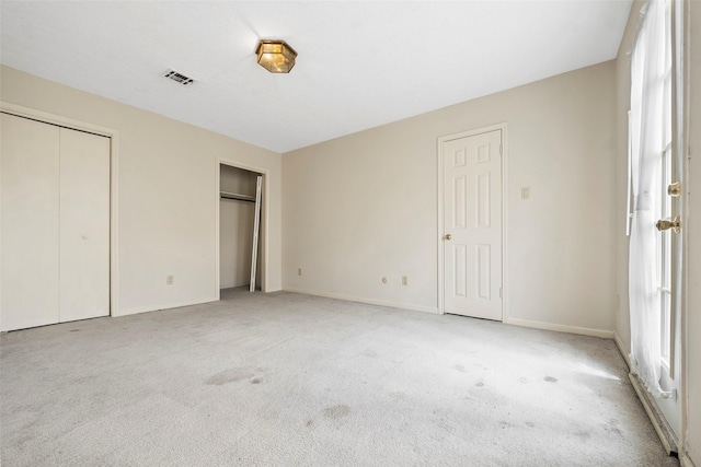 12223 Gladewick Dr, Houston, TX 77077 - unfurnished bedroom featuring two closets and light carpet