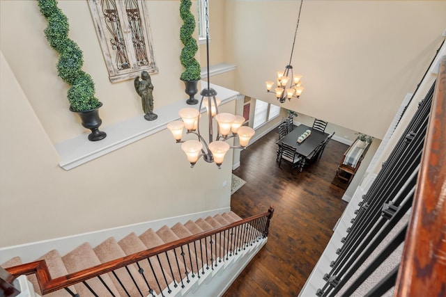 12919 Arlington Meadows Ln, Tomball, TX 77377 - stairway with a chandelier and wood finished floors
