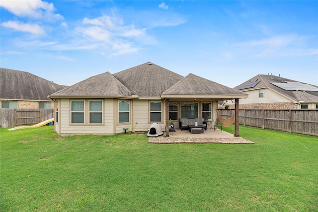 20206 Fossil Valley Ln, Cypress, TX 77433 - rear view of house with a patio, a fenced backyard, an outdoor living space, and roof with shingles