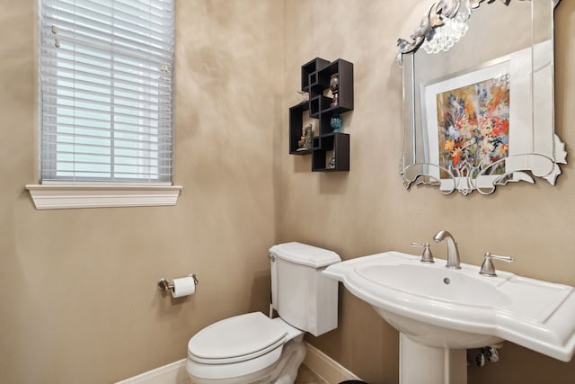 5706 Blossom St, Houston, TX 77007 - half bathroom featuring baseboards and toilet