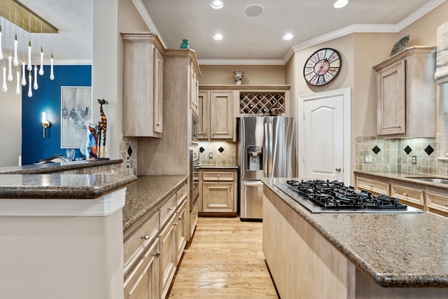 5706 Blossom St, Houston, TX 77007 - kitchen featuring appliances with stainless steel finishes, stone counters, light wood-type flooring, recessed lighting, and decorative backsplash