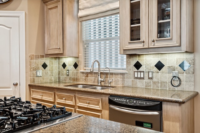 5706 Blossom St, Houston, TX 77007 - kitchen featuring appliances with stainless steel finishes, glass insert cabinets, tasteful backsplash, and light stone counters