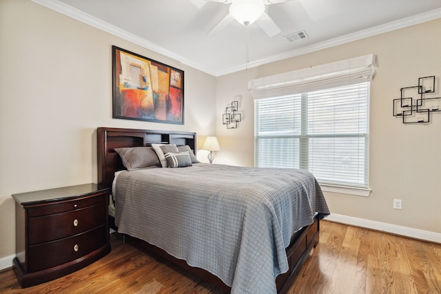 5706 Blossom St, Houston, TX 77007 - bedroom with crown molding, wood finished floors, and ceiling fan