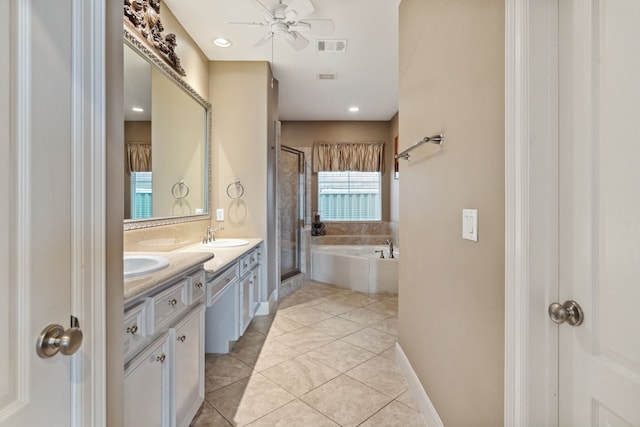 5706 Blossom St, Houston, TX 77007 - full bath featuring a stall shower, double vanity, a bath, ceiling fan, and tile patterned floors