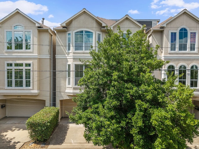 5706 Blossom St, Houston, TX 77007 - multi unit property with stucco siding, a garage, and concrete driveway
