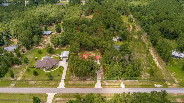 4214 Cross Cut, Cleveland, TX 77328 - aerial view of property and surrounding area featuring property boundaries highlighted and a forest