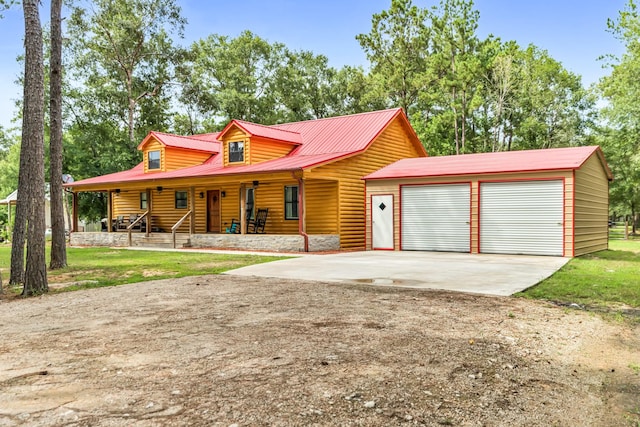 4214 Cross Cut, Cleveland, TX 77328 - view of front of house featuring a porch, a garage, driveway, a metal roof, and faux log siding