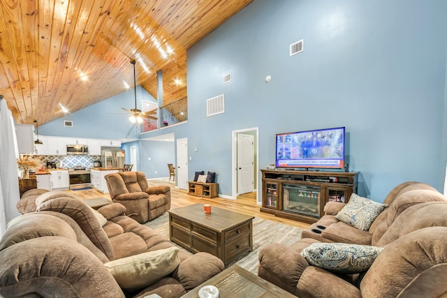 4214 Cross Cut, Cleveland, TX 77328 - living area with high vaulted ceiling, light wood finished floors, and ceiling fan