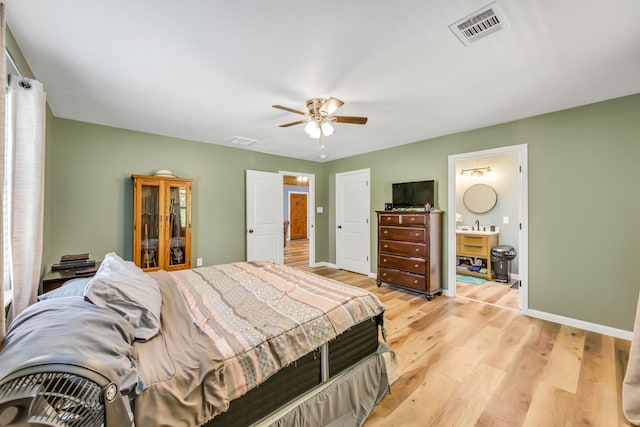 4214 Cross Cut, Cleveland, TX 77328 - bedroom with light wood-style flooring, ceiling fan, and ensuite bathroom