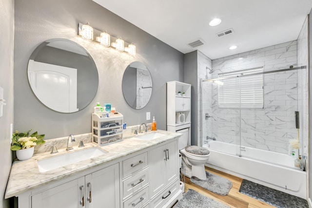 4214 Cross Cut, Cleveland, TX 77328 - bathroom with double vanity, wood finished floors, shower / bath combination with glass door, and recessed lighting