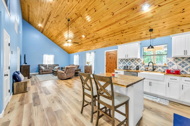 4214 Cross Cut, Cleveland, TX 77328 - kitchen featuring wooden counters, wood ceiling, dishwasher, white cabinets, and a ceiling fan