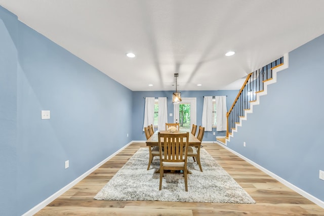 4214 Cross Cut, Cleveland, TX 77328 - dining area with stairs, light wood finished floors, and recessed lighting