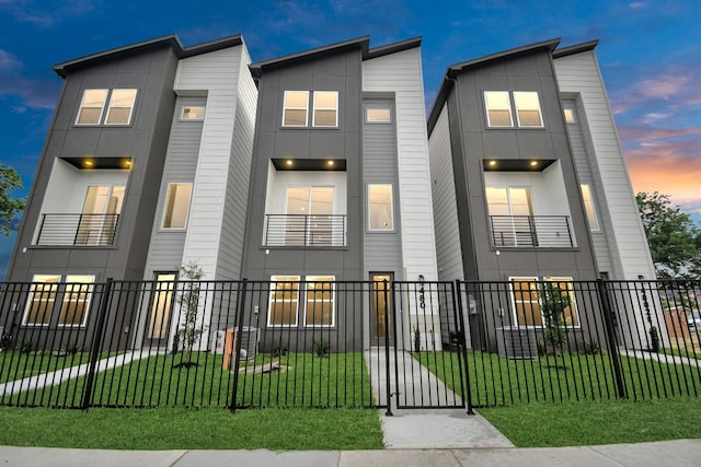 4802 Elysian St Unit C, Houston, TX 77009 - modern home with a fenced front yard and a gate