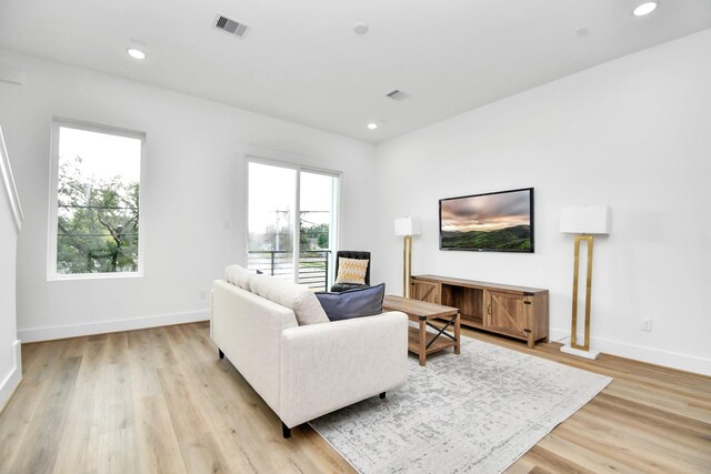 4802 Elysian St Unit C, Houston, TX 77009 - living room featuring light wood-style flooring and recessed lighting