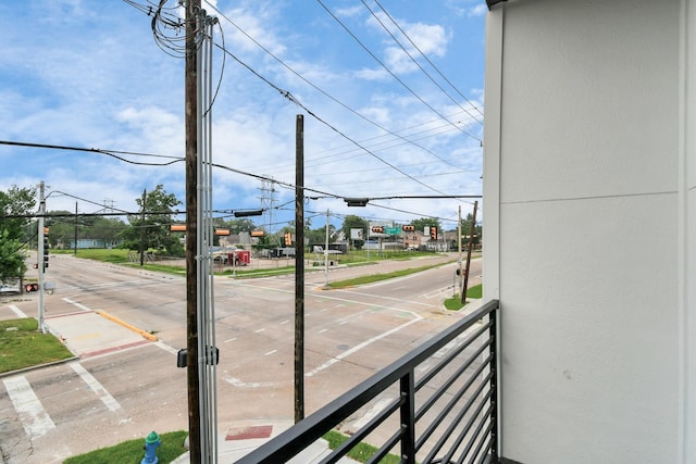 4802 Elysian St Unit C, Houston, TX 77009 - view of asphalt road featuring sidewalks, traffic lights, curbs, and traffic signs
