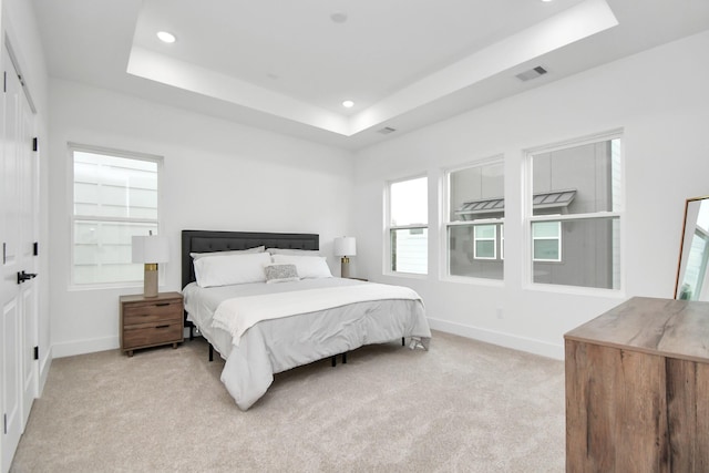 4802 Elysian St Unit C, Houston, TX 77009 - bedroom featuring a raised ceiling, light carpet, and recessed lighting