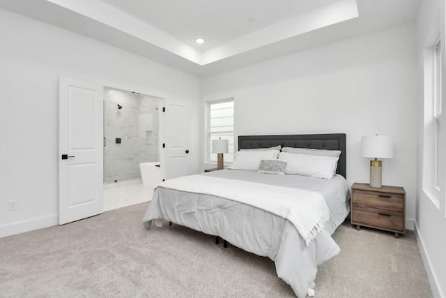 4802 Elysian St Unit C, Houston, TX 77009 - bedroom with light colored carpet, recessed lighting, ensuite bath, and a tray ceiling
