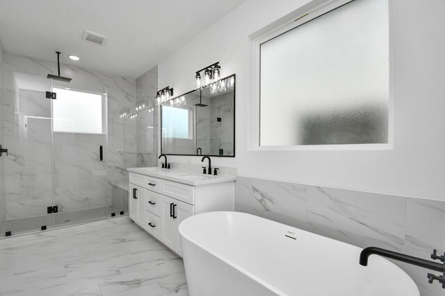 2610 Vance St, Houston, TX 77093 - full bathroom featuring a marble finish shower, a freestanding bath, marble finish floors, and double vanity