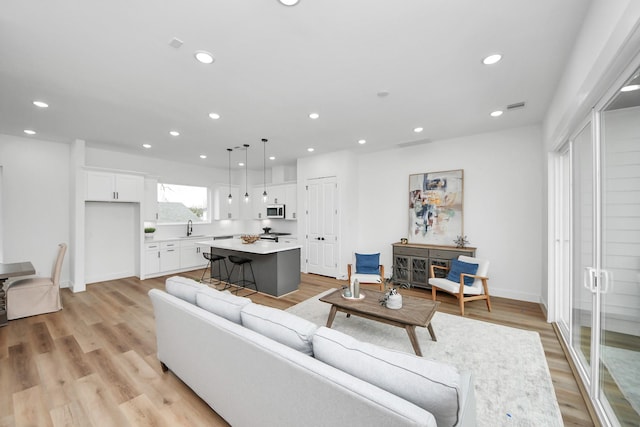 1218 English St, Houston, TX 77009 - living area featuring recessed lighting and light wood-type flooring