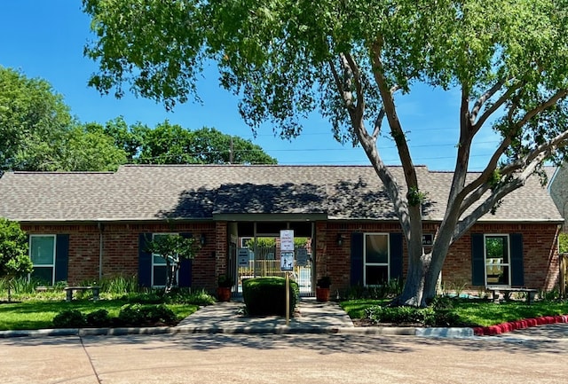 1023 Fountain View Dr, Houston, TX 77057 - ranch-style house with a shingled roof and brick siding