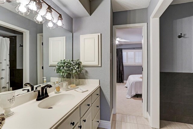 1023 Fountain View Dr, Houston, TX 77057 - full bathroom with vanity, tile patterned flooring, curtained shower, and connected bathroom