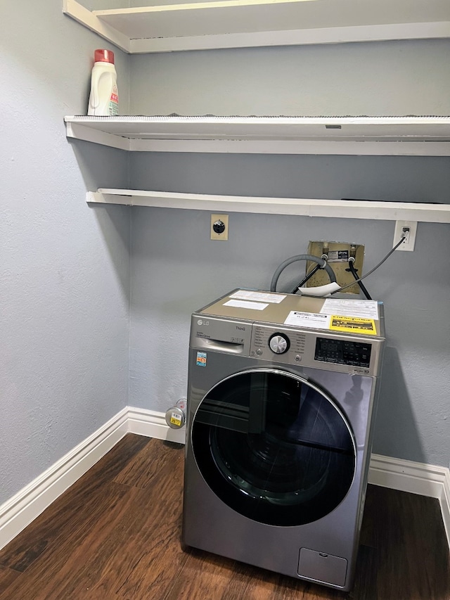 1023 Fountain View Dr, Houston, TX 77057 - washroom with washer / clothes dryer and dark wood-style floors