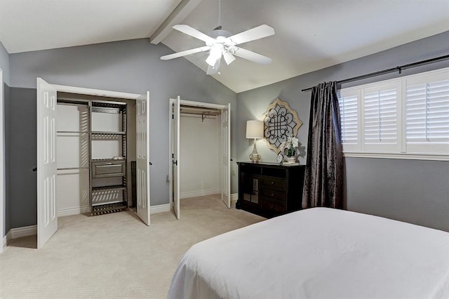 1023 Fountain View Dr, Houston, TX 77057 - bedroom featuring multiple closets, light colored carpet, and ceiling fan