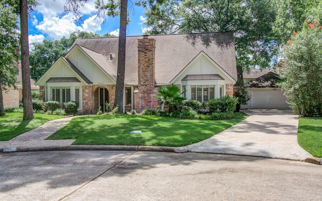3623 Beech Hill Dr, Spring, TX 77388 - view of front of property featuring concrete driveway, a front lawn, a chimney, and brick siding