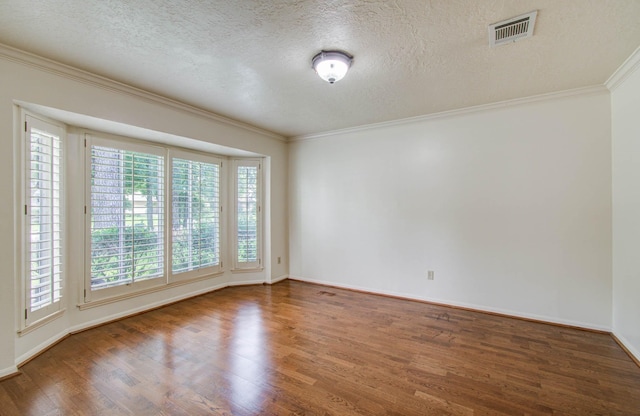 3623 Beech Hill Dr, Spring, TX 77388 - spare room featuring wood finished floors, crown molding, and a textured ceiling