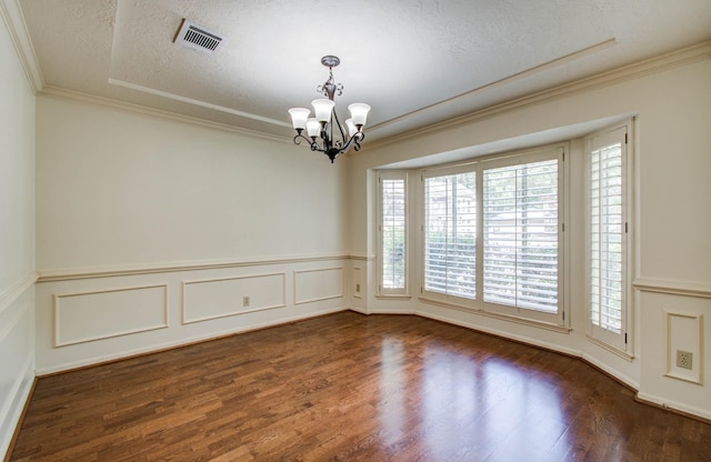 3623 Beech Hill Dr, Spring, TX 77388 - unfurnished room with a chandelier, dark wood finished floors, crown molding, a wainscoted wall, and a textured ceiling