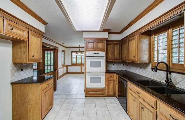 3623 Beech Hill Dr, Spring, TX 77388 - kitchen with white double oven, dishwashing machine, a textured ceiling, light tile patterned flooring, and backsplash
