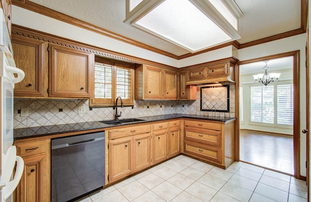 3623 Beech Hill Dr, Spring, TX 77388 - kitchen featuring dishwasher, dark countertops, plenty of natural light, and ornamental molding