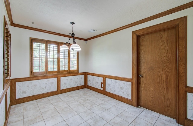 3623 Beech Hill Dr, Spring, TX 77388 - unfurnished dining area featuring wainscoting, ornamental molding, a textured ceiling, a chandelier, and light tile patterned floors